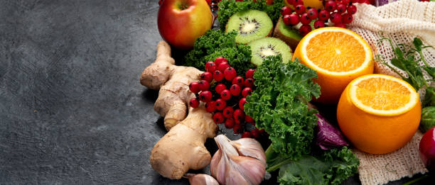 Foods high in vitamin c on dark background. healthy diet concept. copy space